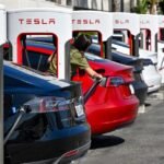 A Tesla vehicle quickly detaching from a Supercharger cable during an emergency, with the cable breaking away.