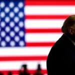 Trump's Trillion-Dollar Gamble: Cash Pledges and Midterm Election Maneuvers 6 Former President Donald Trump speaking at a campaign rally in Oklahoma, gesturing to the crowd.
