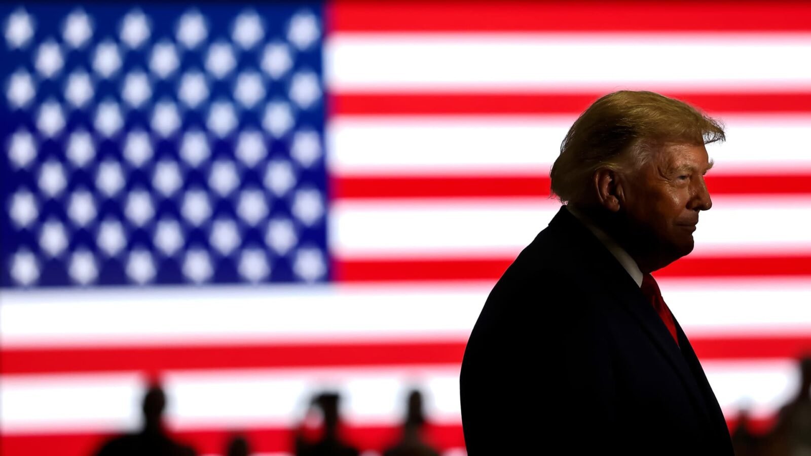 Former President Donald Trump speaking at a campaign rally in Oklahoma, gesturing to the crowd.