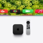Elevate Your Entertainment: Unpacking the Latest tvOS 27.2 Features for Apple TV 3 Apple TV 4K device with Siri Remote on a modern media console, displaying a vibrant tvOS screen saver.