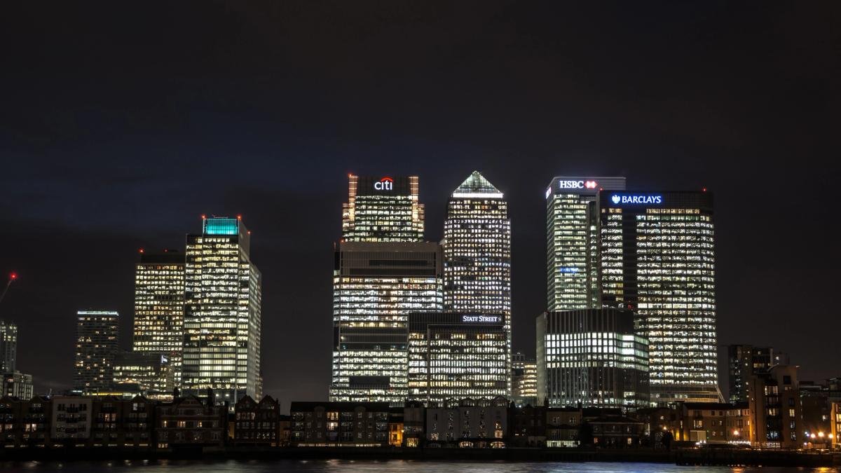 Canary Wharf skyline in London, symbolizing the UK's financial sector and its interaction with digital assets.