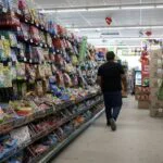 Bags of candy displayed on store shelves, symbolizing consumer goods affected by inflation.