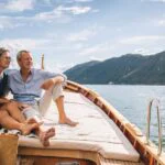 Switzerland's Century-Old Secret: How Modest Wealth Taxes Attract Millionaires 6 Swiss Alps with a modern financial district in the foreground, symbolizing wealth and stability