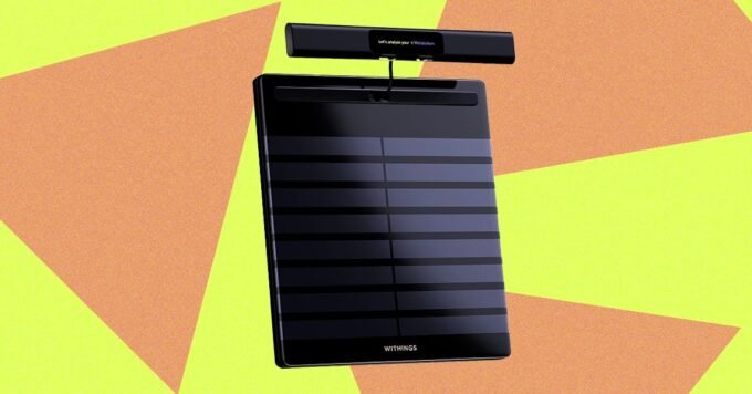 Withings BodyScan 2 smart scale with integrated handlebars and color LCD screen displaying health metrics.